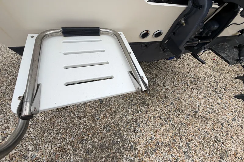 Slide: The Image of 2003 Parker 21SE Center Console boat swim platform with stainless steel ladder. - 15