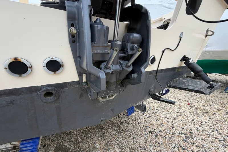 Slide: The Image of 2003 Parker 21SE Center Console boat engine mount on gravel surface. - 16