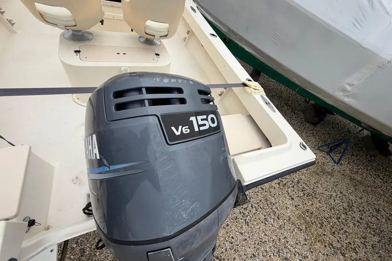 Slide: The Image of 2003 Parker 21SE Center Console with Yamaha V6 150 outboard motor. - 17