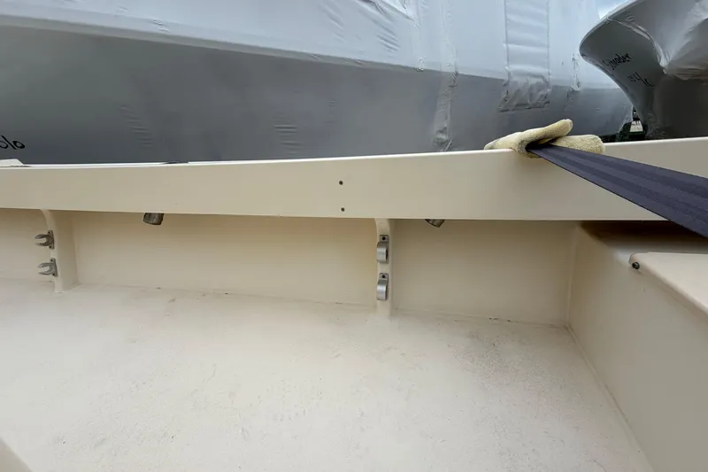Slide: The Image of 2003 Parker 21SE Center Console boat interior with clean deck and secured cover. - 26