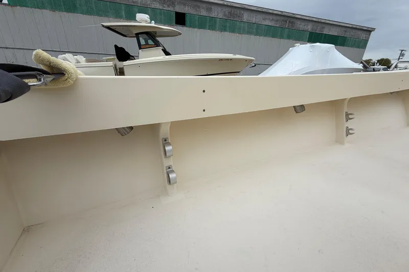 Slide: The Image of 2003 Parker 21SE Center Console boat interior with docked vessels in background. - 27