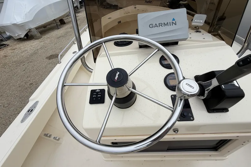 Slide: The Image of Steering console of a 2003 Parker 21SE Center Console boat with Garmin navigation. - 30