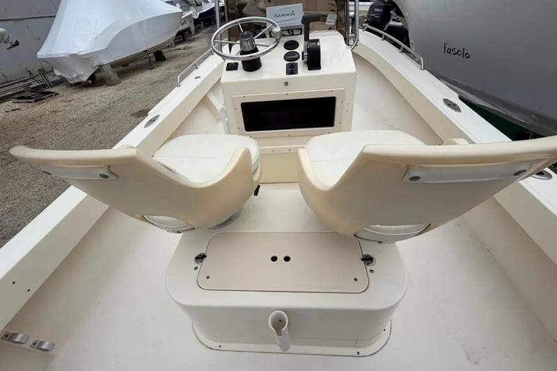 Slide: The Image of 2003 Parker 21SE Center Console boat interior with dual seats and steering console. - 31