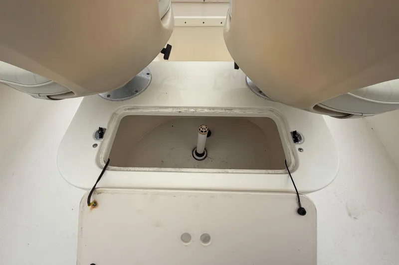 Slide: The Image of 2003 Parker 21SE Center Console boat interior with open storage compartment. - 38