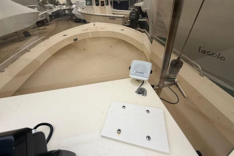 Slide: The Image of 2003 Parker 21SE Center Console boat interior with speaker and control panel. - 44