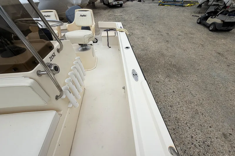 Slide: The Image of 2003 Parker 21SE Center Console boat interior with seating and rod holders. - 46
