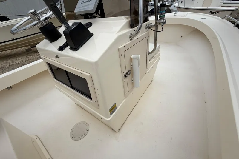 Slide: The Image of 2003 Parker 21SE Center Console boat interior with steering wheel and control panel. - 51