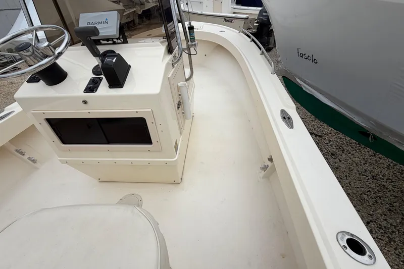 Slide: The Image of 2003 Parker 21SE Center Console boat interior with steering wheel and control panel. - 52