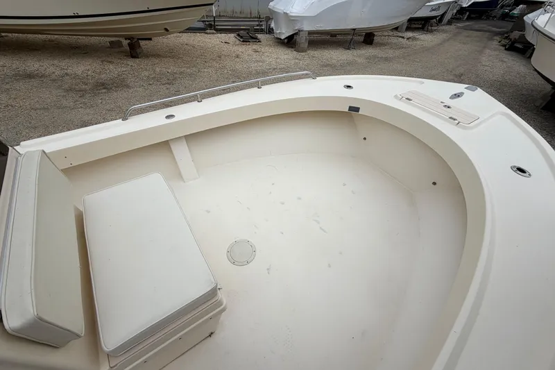 Slide: The Image of 2003 Parker 21SE Center Console boat interior with seating and storage. - 55