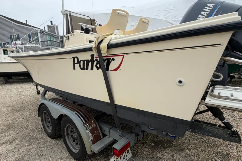 Slide: The Image of 2003 Parker 21SE Center Console boat on trailer, parked outdoors. - 7