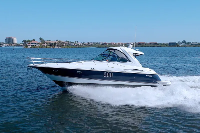 Slide: The Image of 2008 Cruisers Yachts 420 Express cruising on a sunny day in open water. - 10