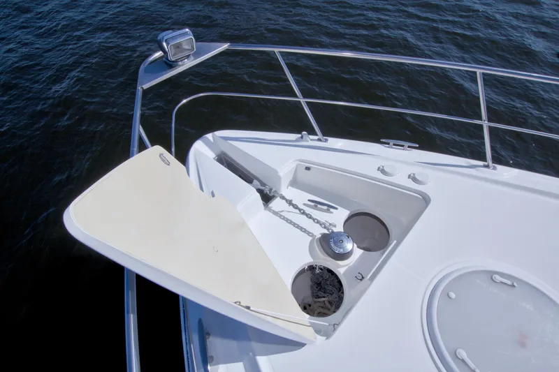 Slide: The Image of Bow of 2008 Cruisers Yachts 420 Express with anchor storage and railing. - 17