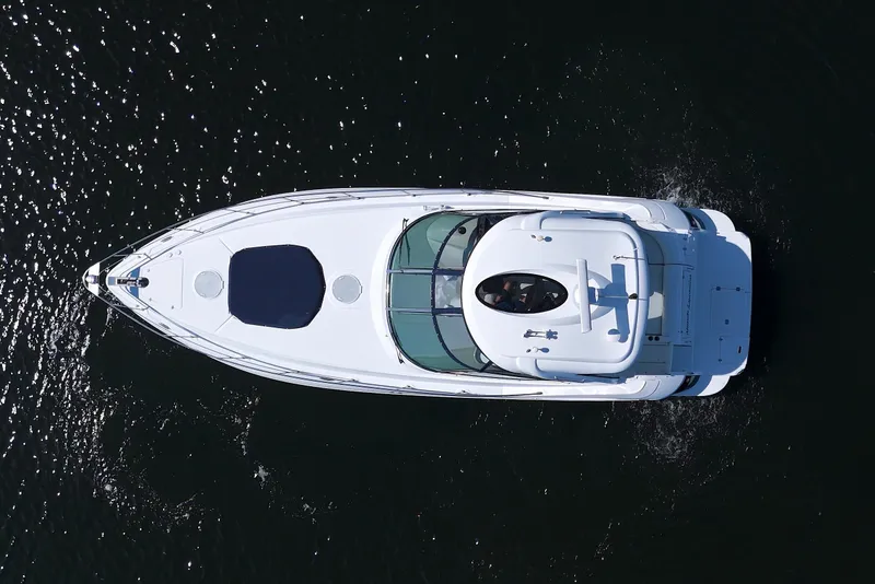 Slide: The Image of Aerial view of 2008 Cruisers Yachts 420 Express on dark water. - 2