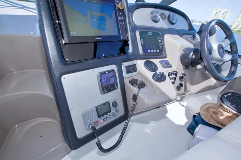 Slide: The Image of Helm of 2008 Cruisers Yachts 420 Express with navigation equipment and steering wheel. - 29