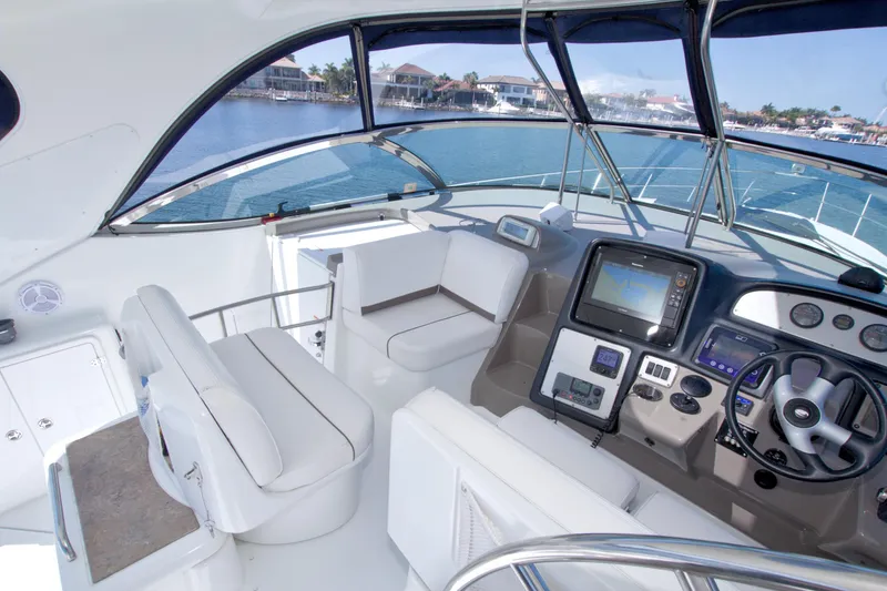 Slide: The Image of 2008 Cruisers Yachts 420 Express cockpit with modern navigation system and luxurious seating. - 35