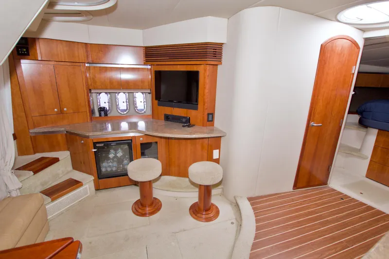 Slide: The Image of Luxurious 2008 Cruisers Yachts 420 Express interior with wood cabinetry and seating area. - 38