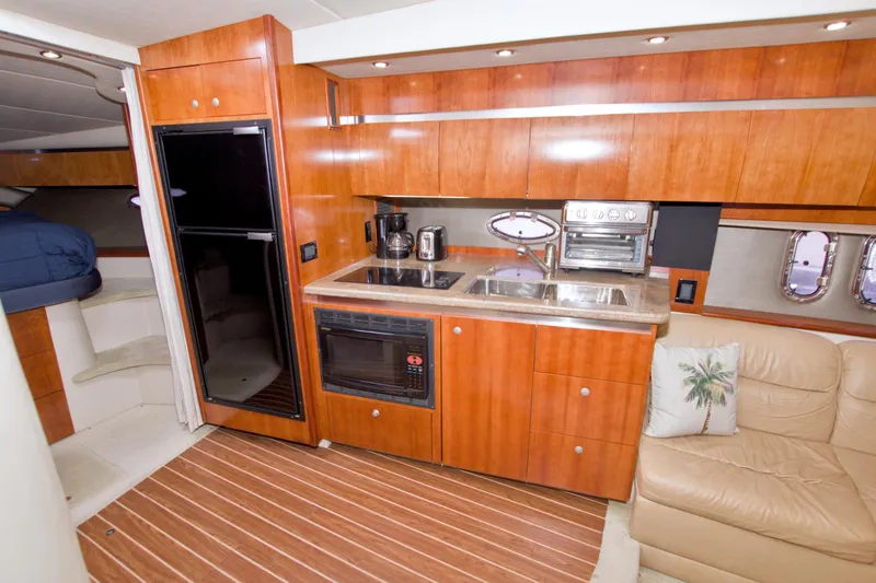 Slide: The Image of Luxurious 2008 Cruisers Yachts 420 Express interior with modern kitchen and cozy seating area. - 41