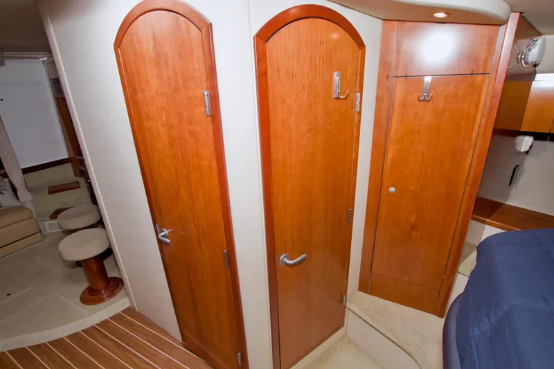 Slide: The Image of Interior of 2008 Cruisers Yachts 420 Express with wooden doors and cozy seating area. - 46