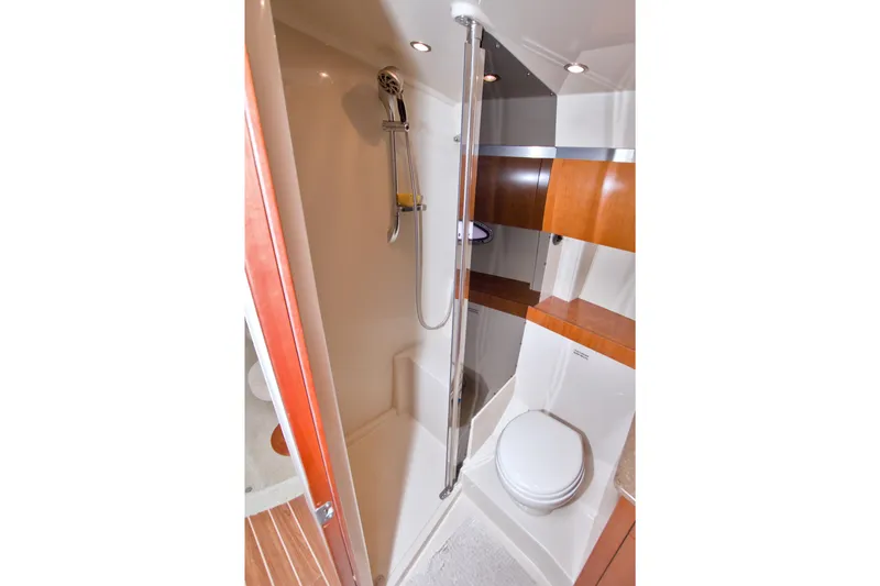 Slide: The Image of Bathroom interior of 2008 Cruisers Yachts 420 Express, featuring shower and toilet. - 49
