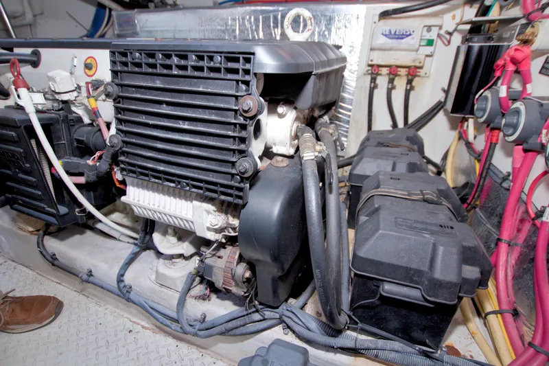 Slide: The Image of Engine room of 2008 Cruisers Yachts 420 Express, showcasing mechanical components and wiring. - 60