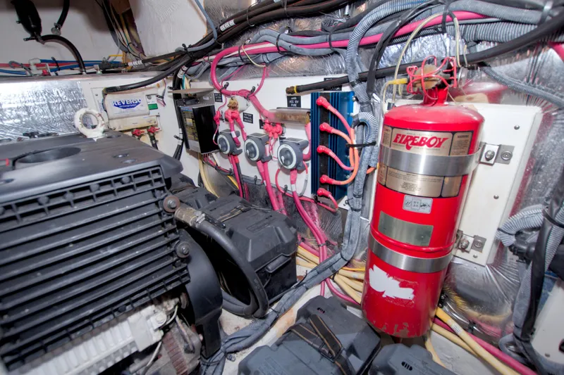 Slide: The Image of Engine room of 2008 Cruisers Yachts 420 Express with fire extinguisher and wiring. - 61
