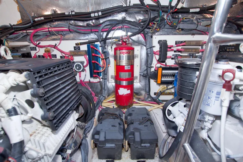 Slide: The Image of Engine room of 2008 Cruisers Yachts 420 Express with wiring and fire extinguisher. - 62