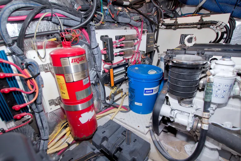 Slide: The Image of Engine room of 2008 Cruisers Yachts 420 Express with fire extinguisher and maintenance equipment. - 63