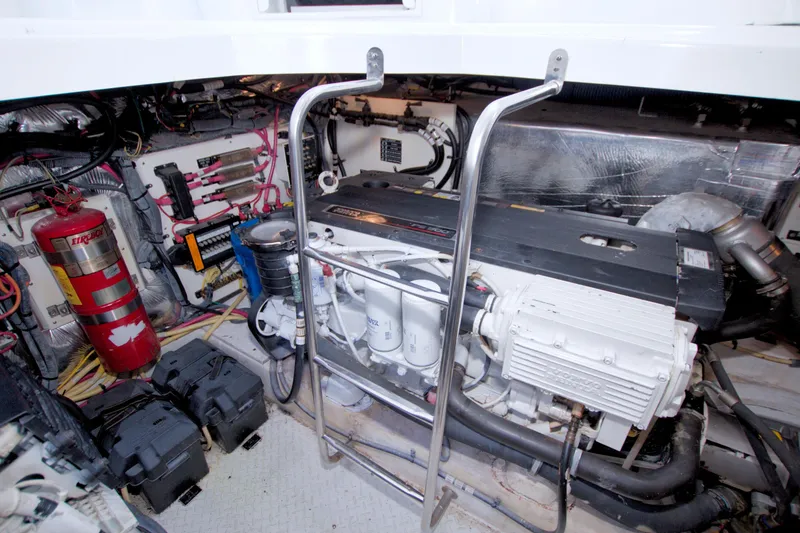 Slide: The Image of Engine room of 2008 Cruisers Yachts 420 Express, featuring mechanical components and fire extinguisher. - 66