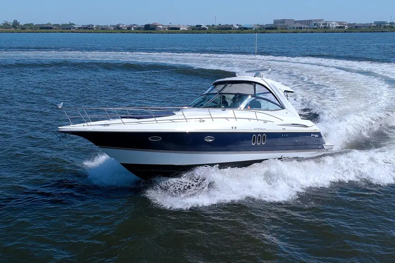 Slide: The Image of 2008 Cruisers Yachts 420 Express cruising on open water, showcasing sleek design and performance. - 7