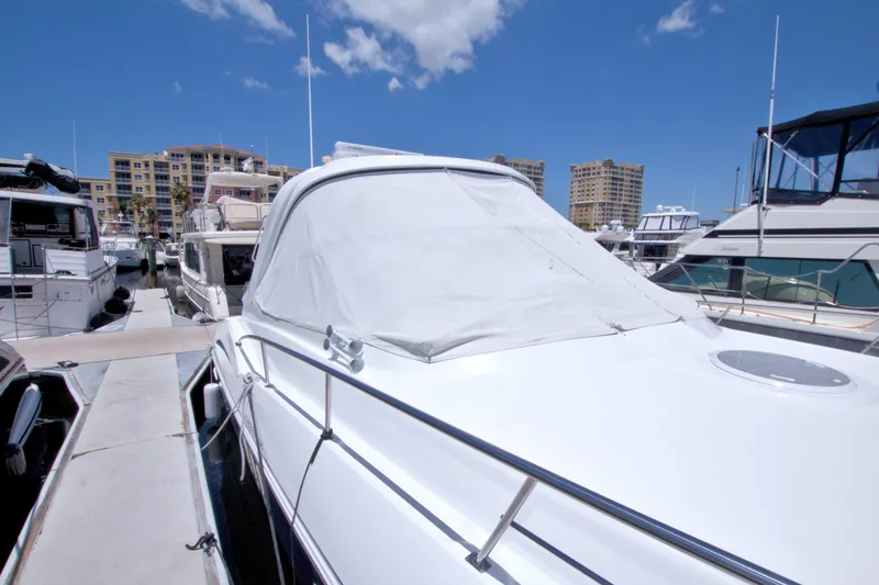 Slide: The Image of 2008 Cruisers Yachts 420 Express docked at marina under clear blue sky. - 70