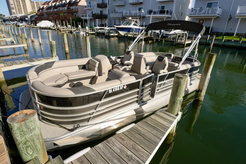 Slide: The Image of 2023 Berkshire 24 RFX LE 2.75 pontoon boat docked in a marina. - 12