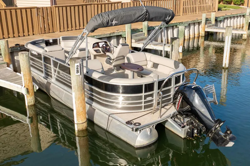 Slide: The Image of 2023 Berkshire 24 RFX LE 2.75 pontoon boat docked at marina. - 13