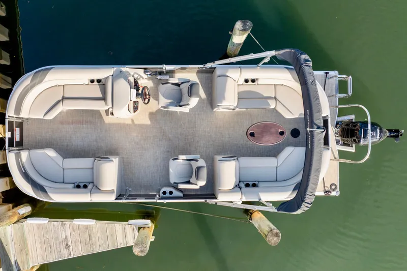 Slide: The Image of 2023 Berkshire 24 RFX LE 2.75 pontoon boat docked, aerial view. - 14