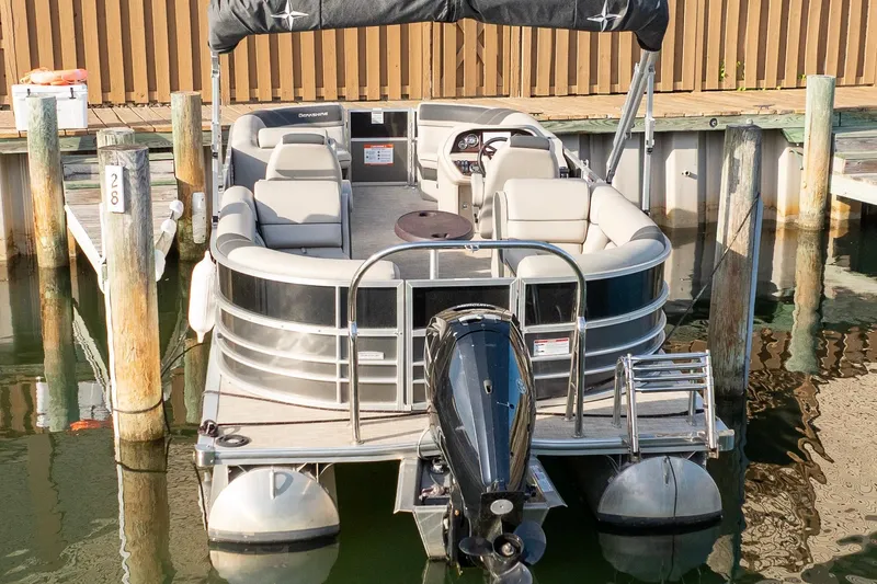 Slide: The Image of 2023 Berkshire 24 RFX LE 2.75 pontoon boat docked at marina. - 15