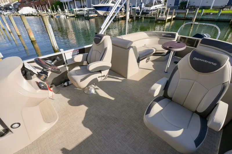 Slide: The Image of 2023 Berkshire 24 RFX LE 2.75 pontoon boat interior with plush seating and helm. - 4