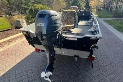 Slide: The Image of 2017 Starcraft Seafarer 14 DLX SC boat with Yamaha 25HP outboard motor. - 2