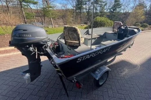 Slide: The Image of 2017 Starcraft Seafarer 14 DLX SC boat with Yamaha motor on trailer. - 3
