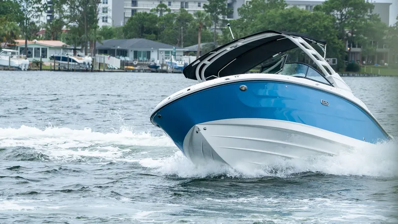 Slide: The Image of 2026 Sea Ray SDX 230 Outboard cruising on the water. - 1