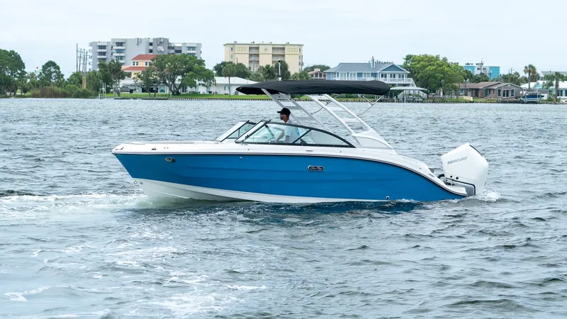 Slide: The Image of 2026 Sea Ray SDX 230 Outboard on water, blue design. - 10