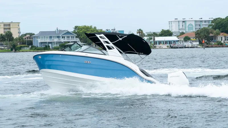 Slide: The Image of 2026 Sea Ray SDX 230 Outboard boat on the water. - 11