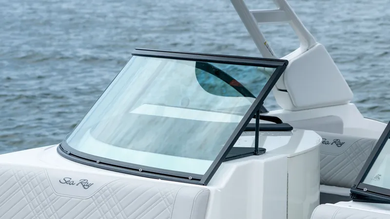 Slide: The Image of 2026 Sea Ray SDX 230 Outboard boat on calm water. - 12