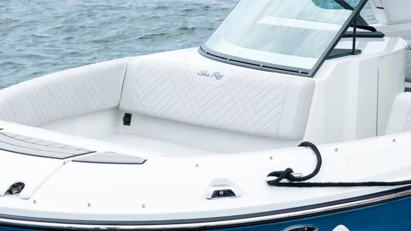 Slide: The Image of 2026 Sea Ray SDX 230 Outboard with luxurious white seating area. - 13