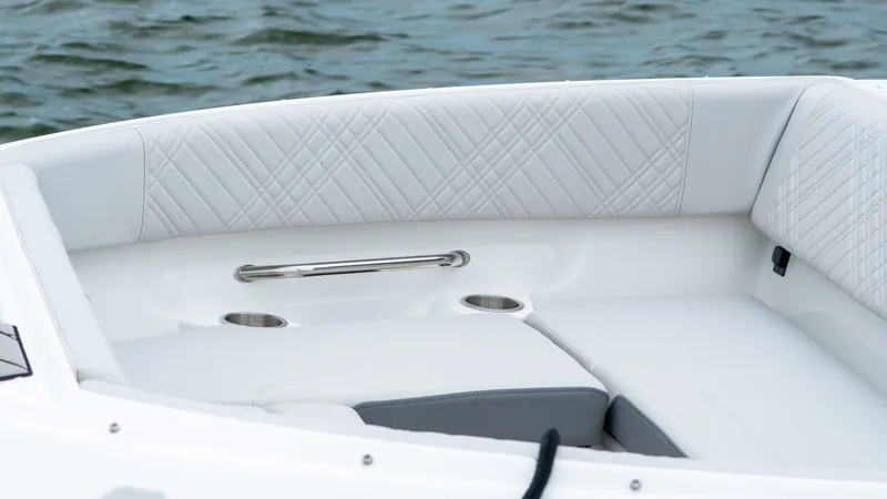 Slide: The Image of Interior of 2026 Sea Ray SDX 230 Outboard with white upholstery. - 14