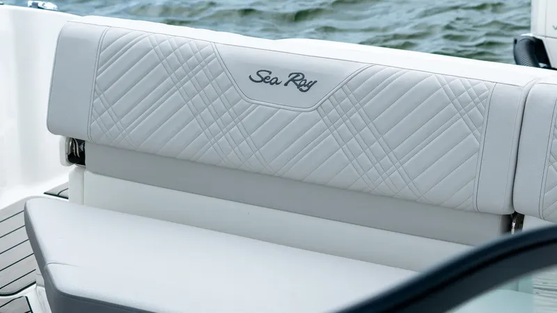 Slide: The Image of 2026 Sea Ray SDX 230 Outboard seating by the water. - 15
