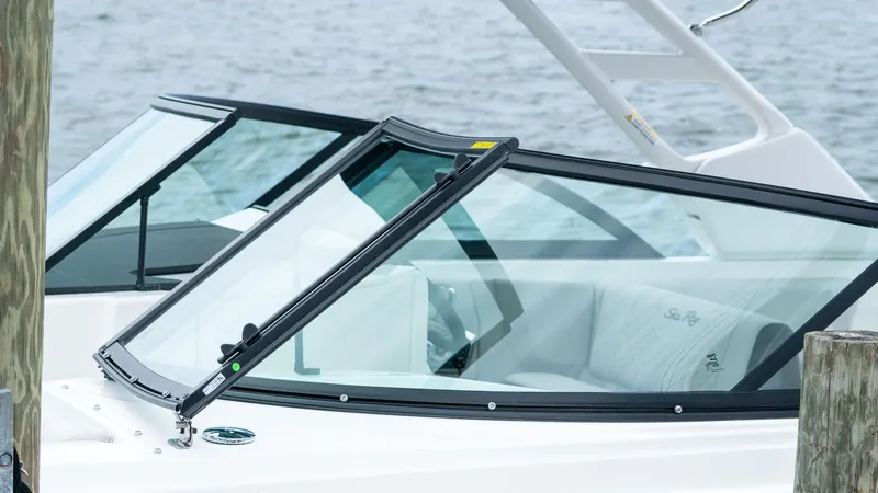 Slide: The Image of 2026 Sea Ray SDX 230 Outboard boat at dock. - 17