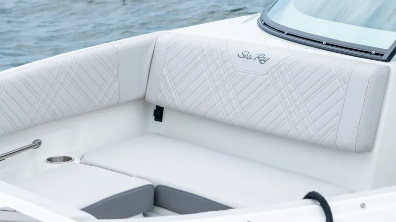 Slide: The Image of Luxurious seating area on Sea Ray SDX 230 Outboard 2026. - 18