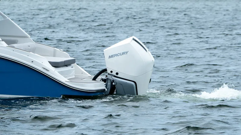 Slide: The Image of 2026 Sea Ray SDX 230 Outboard on the water. - 2