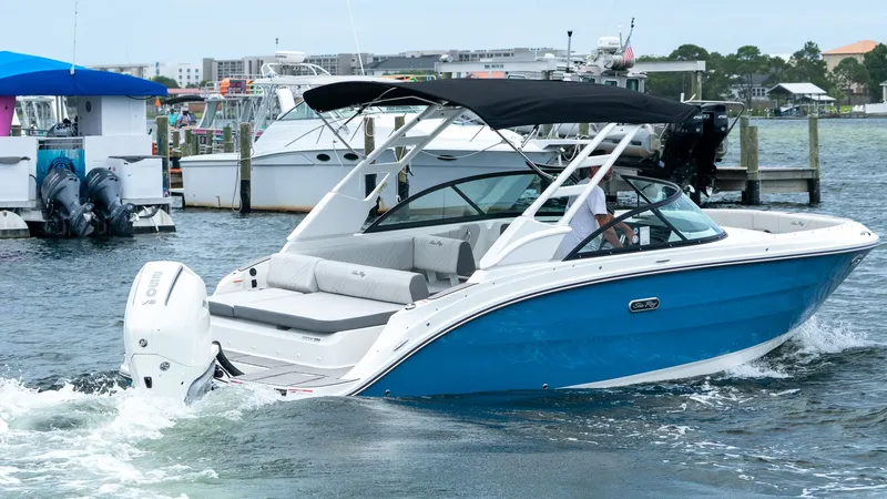 Slide: The Image of 2026 Sea Ray SDX 230 Outboard boat on the water. - 22