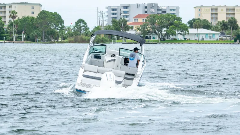 Slide: The Image of Sea Ray SDX 230 Outboard 2026 cruising on water. - 3