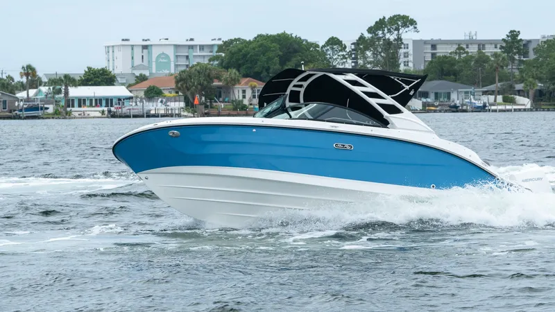 Slide: The Image of 2026 Sea Ray SDX 230 Outboard on water, blue and white body. - 4